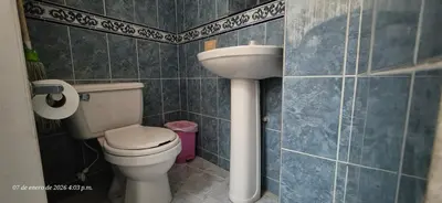 a bathroom with a toilet and a sink at Casa de descanso en Doradal Hacienda Napoles in Doradal