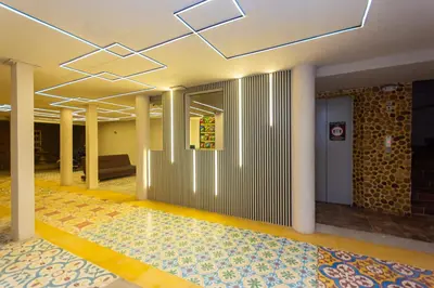 a hallway of a building with a lobby with a lobby at Hotel Bossanova in Rionegro
