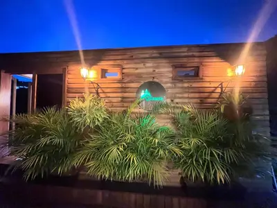 a house with a bunch of plants in front of it at Qimera Ecolodge - Cabaña a 7 Min del Aeropuerto JMC in Guarne