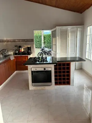 a kitchen with a stove and a counter top at Casa Hotel Villa Sabrosura in Mariquita