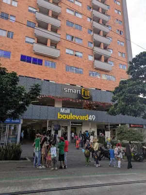 a crowd of people standing outside of a building at Baseloft in Medellín