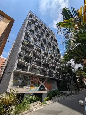a tall building with balconies on the side of it at Baseloft in Medellín