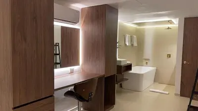 a bathroom with a sink and a toilet and a mirror at One Apartments Provenza in Medellín