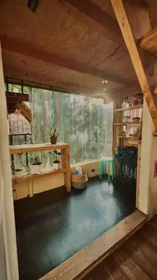 a room with a large pool of water in a house at Lodge Kumbre Santa Elena Bosque Privado in Medellín