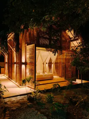 a wooden building with a gate and a room at Sandagua Hotel-Doradal, Antioquia in Puerto Triunfo