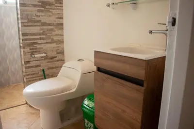 a bathroom with a toilet and a sink at 2 Cuadras Estadio - La 70, Laureles, 700MB, AC in Medellín