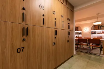 a row of wooden lockers in a room at 103 Design Loft Escape Hammock AC & Great Vibes in Medellín