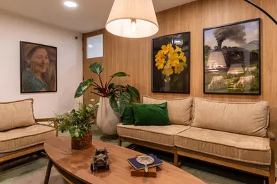 a living room with two couches and a table at 103 Design Loft Escape Hammock AC & Great Vibes in Medellín