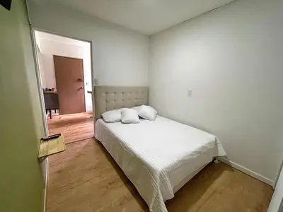 a bedroom with a bed with two pillows on it at Espectacular apartaestudio en envigado cerca de todo in Envigado