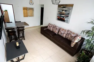 a living room with a couch and a table at La Esquinita de Miraflores in Medellín