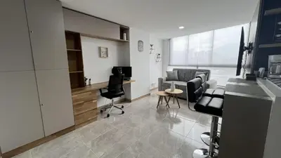 a living room with a couch and a table and chairs at Apto Moderno,Tranquilo, Avenida las Vegas, cerca al Metro, a 20 min de Provenza in Sabaneta