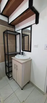 a bathroom with a sink and a mirror at Casa Campestre Tara in Barbosa