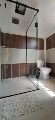 a glass shower in a bathroom with a toilet at Casa Campestre Tara in Barbosa