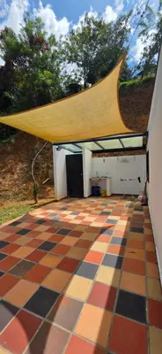 a roof on a building with a checkered floor at Casa Campestre Tara in Barbosa