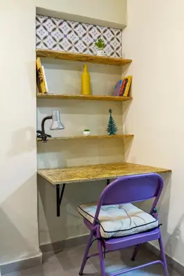 a purple chair sitting in front of a desk at Envigado Centro Piso 1 in Envigado