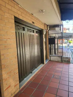 a pair of doors on a brick building at Envigado Centro Piso 1 in Envigado