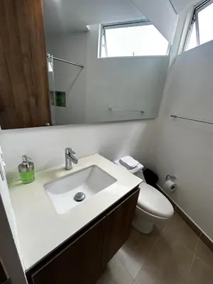 a bathroom with a sink and a toilet at Apartamento moderno ubicado en zona exclusiva in Manizales