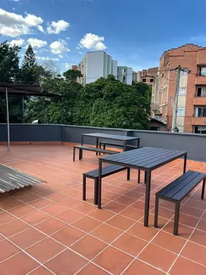 three benches sitting on top of a patio at Dúplex Céntrico Con Servicios Premium in Medellín