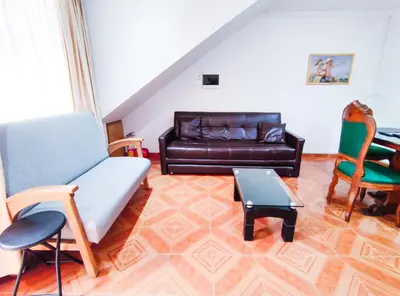 a living room with a couch and a table at Casa de Confort con Parqueadero Privado in Medellín