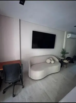 a living room with a couch and a chair at Modern & Elegant Loft in El Poblado 217 in Medellín