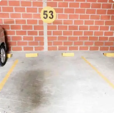 a brick wall with a speed limit sign in a parking lot at 1008 New Apartment in Poblado, panoramic view in Medellín