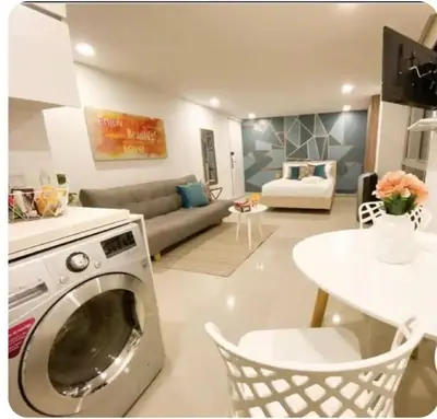 a kitchen and living room with a washer at 1008 New Apartment in Poblado, panoramic view in Medellín