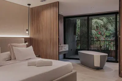 a bedroom with a bed and a tub and a window at Premium Smart Loft with Alexa in El Poblado in Medellín