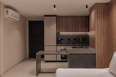 a kitchen with a table and a counter top at Premium Smart Loft with Alexa in El Poblado in Medellín