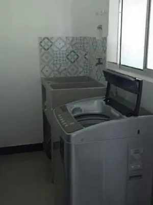 a washer and dryer in a small room at Serenity Poolside Retreat in Santa Fe Villa Bonita in Santa Fe de Antioquia