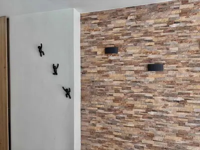 a brick wall with three black birds on it at Comfy Loft near El Tesoro MDE OSLO in Medellín