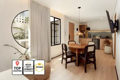 a kitchen and dining room with a table and chairs at Casa Fiora Oasis in Medellín