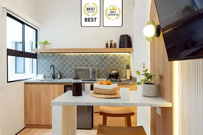 a kitchen with a table with a cake on it at Casa Fiora Oasis in Medellín