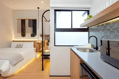 a bathroom with a bed and a sink in a room at Casa Fiora Oasis in Medellín
