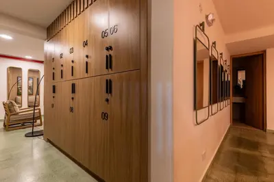 a row of wooden lockers in a hallway at 201 Stylish Retreat in Laureles Area Terrace AC in Medellín