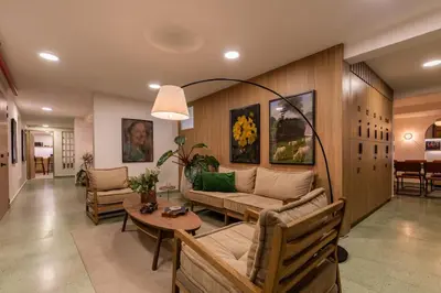 a living room with a couch and a table at 202 Modern Stay in Laureles Area Cozy Balcony AC in Medellín