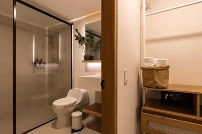 a bathroom with a toilet and a shower at 202 Modern Stay in Laureles Area Cozy Balcony AC in Medellín