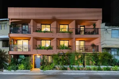 an apartment building with plants on the balconies at 301 Live Local Balcony Loft in Vibrant Laureles area in Medellín