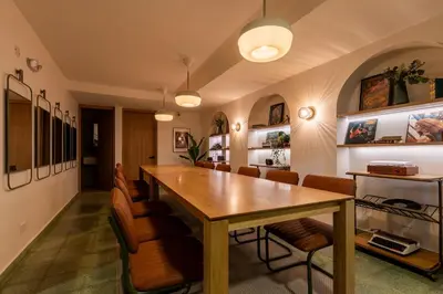 a dining room with a wooden table and chairs at 301 Live Local Balcony Loft in Vibrant Laureles area in Medellín