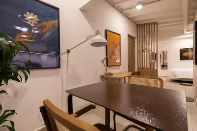 a dining room with a table and chairs at 303 Balance and Design Loft with AC in Laureles area in Medellín