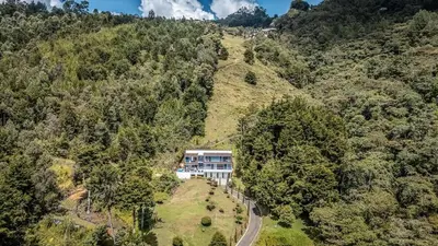 an aerial view of a house on a mountain at Mansión en las palmas Pool ,Jacuzzi,View in Medellín