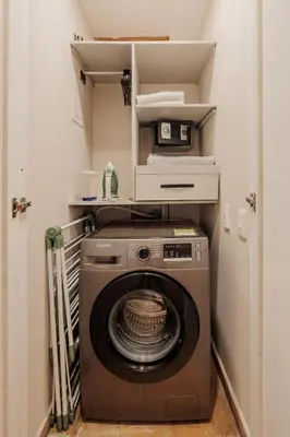 a washer and dryer in a small room at Loft comodo y central con AC y Terraza propia en Astorga Poblado in Medellín