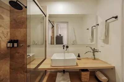 a bathroom with a sink and a shower at Loft comodo y central con AC y Terraza propia en Astorga Poblado in Medellín