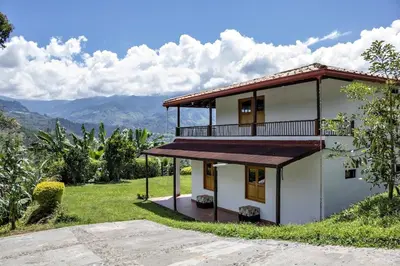 a house with a view of the mountains at Entre Cafetales in Jardin