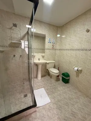a bathroom with a shower and a toilet and a sink at Casa en Poblado para grupos in Medellín