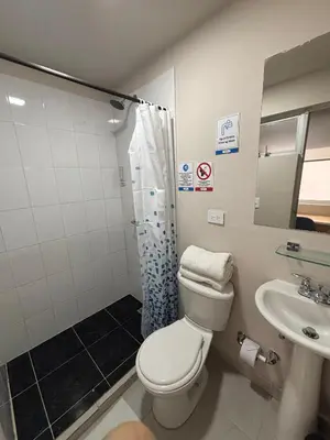 a bathroom with a toilet and a sink at Casa en Poblado para grupos in Medellín