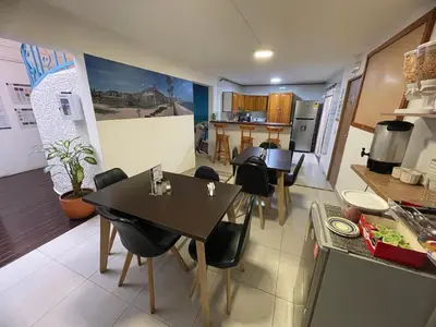 a kitchen and dining room with a table and chairs at Casa en Poblado para grupos in Medellín