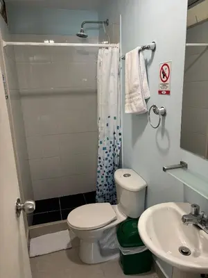 a bathroom with a toilet and a sink at Casa en Poblado para grupos in Medellín