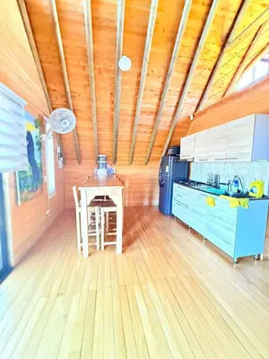 a kitchen with a table and a stove in a room at Glamping en Rionegro in Rionegro