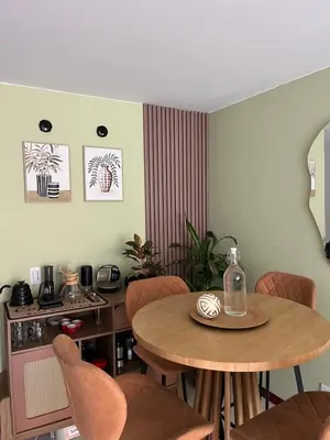 a dining room with a wooden table and chairs at Hermosa habitación con excelente ubicación in Medellín