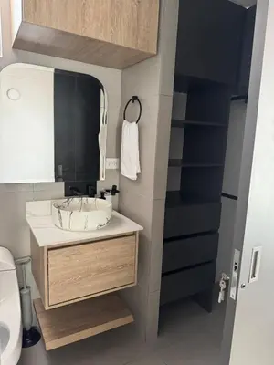 a bathroom with a sink and a mirror at Full apartment in Laureles in Medellín
